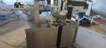 Automatic self-adhesive labeling machine for cylindrical bottles