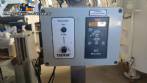 Automatic self-adhesive labeling machine for cylindrical bottles