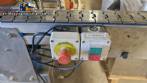 Automatic self-adhesive labeling machine for cylindrical bottles