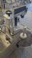Automatic self-adhesive labeling machine for cylindrical bottles