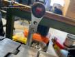 Automatic self-adhesive labeling machine for cylindrical bottles