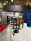 Automatic self-adhesive labeling machine for cylindrical bottles
