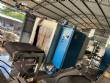 Automatic baling machine with shrink tunnel for bottles and jars in bales.