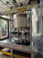 Packaging line with IMSB bung capper, Maqmundi labeler and accumulator table