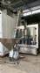 Packaging line with IMSB bung capper, Maqmundi labeler and accumulator table