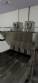 Automatic stainless steel deep fryer for donuts and cream puffs.