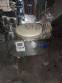 Erli rotary liquid filling machine with 4 pistons, 14,400 units per hour.