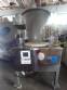 Erli rotary liquid filling machine with 4 pistons, 14,400 units per hour.