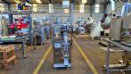 Dosing and packaging machine for granular and powdered products