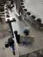 Bottle screw filler with 3 nozzles