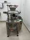 Automatic volumetric dosing packaging machine for powder products.