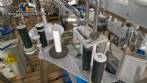 Automatic double-head labeling machine for cylindrical and flat bottles, Tudela, 3,000 labels per hour.