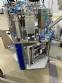 Rotary filling machine with Bramak aa jar capping sealer