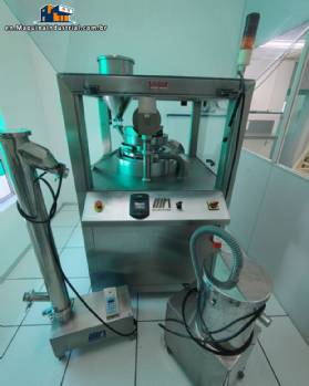 Neuberger rotary tablet press, 20 punches, 900 tablets per minute.