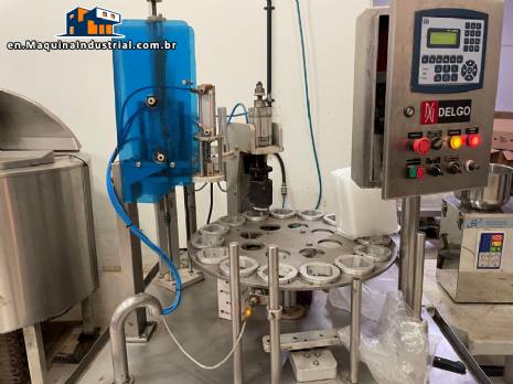 Stainless steel rotary sealer with aluminum seal for Delgo jars, cups and bottles.