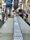Labeling machine for dropper bottles with double printhead transparent stainless steel label