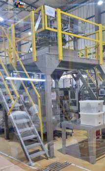 Masipack 16 Twin multi-head vertical packaging machine with conveyor belt and platform.