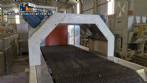 Labeling machine with steam sleeve tunnel and bottle baler