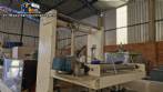 Labeling machine with steam sleeve tunnel and bottle baler
