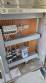 Labeling machine with steam sleeve tunnel and bottle baler