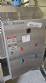 Labeling machine with steam sleeve tunnel and bottle baler