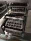 Automatic filling and sealing machine for gelatin cups, 12,000 units/hour.
