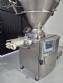 Handtmann vacuum stuffer with twister and tilting elevator, up to 6,000 kg per hour.