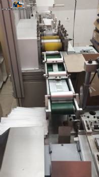 Automatic machine for disposable surgical TNT masks with nose clip, producing 150 to 180 masks per minute. Automatic machine for disposable surgical TNT masks with nose clip, producing 150 to 180 masks per minute.