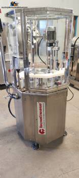 Bottle and jar screwing machine with automatic cap feeding system Bottle and jar screwing machine with automatic cap feeding system